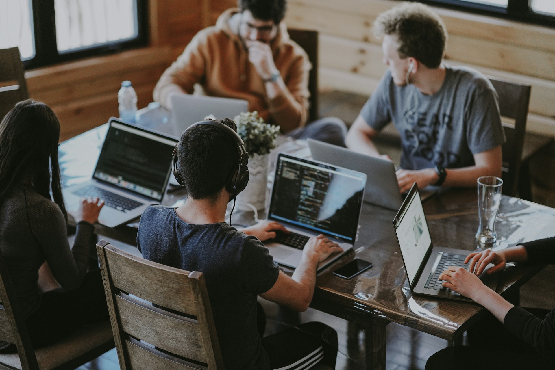 Professional team collaborating on technology solutions in a modern office environment